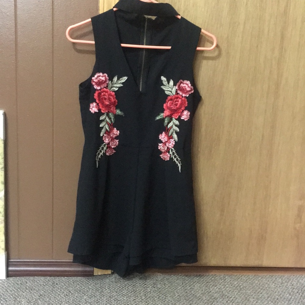Black romper with rose detailing